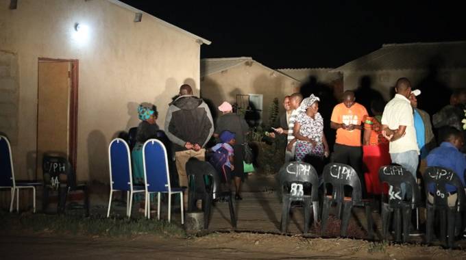 Mourners gather at Blessing's house