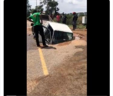 Car fall into a pothole