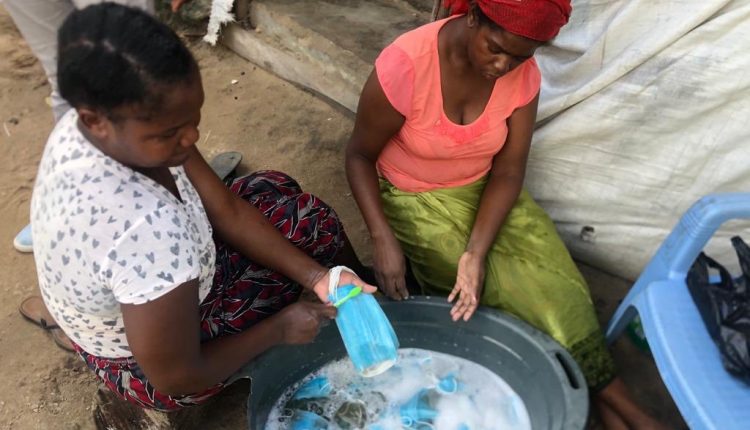 Mozambican Women Caught Washing Used Face Masks