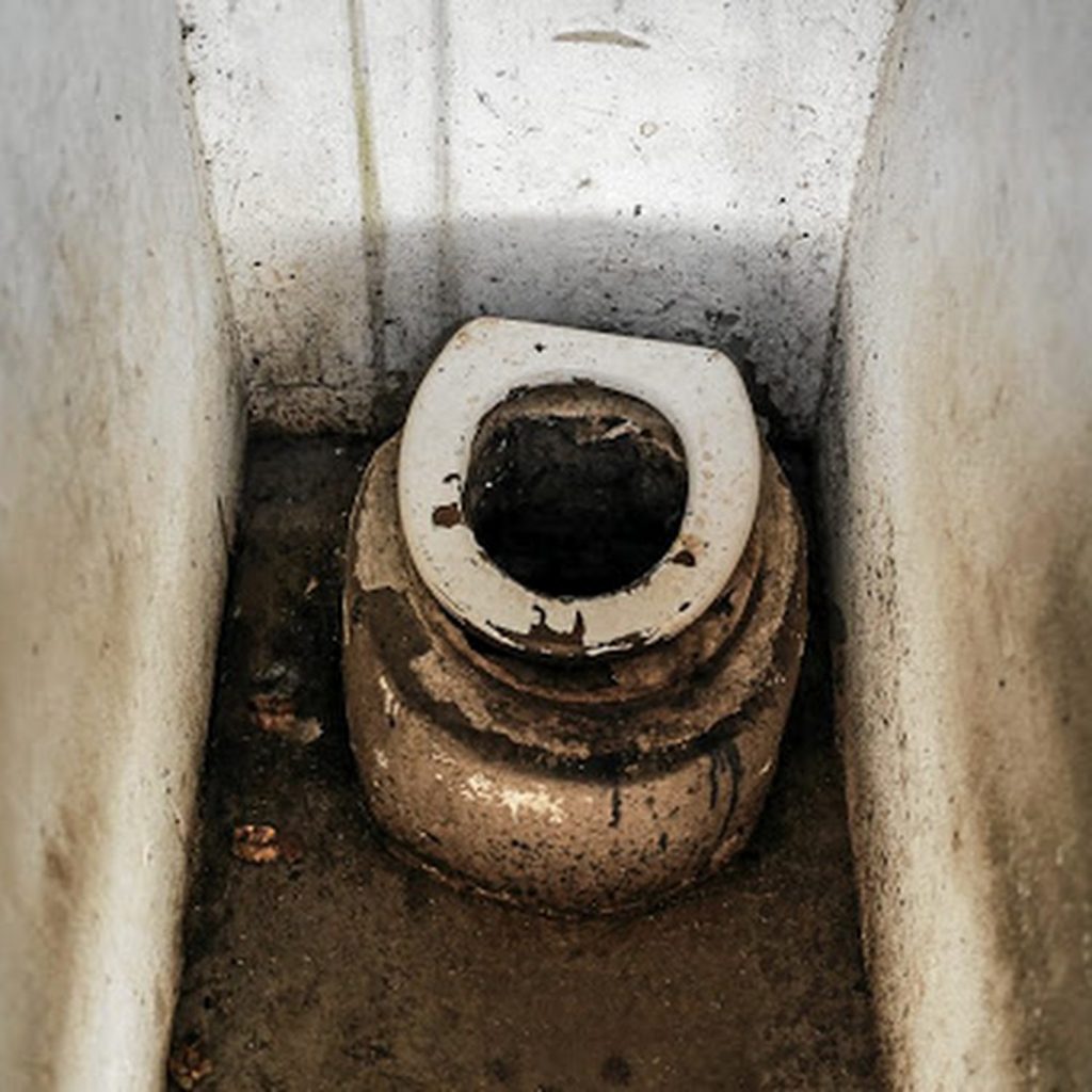 Principal Suspended After Lowering Pupil Into Pit Toilet To Retrieve Missing Phone Leaving Him Covered In Waste