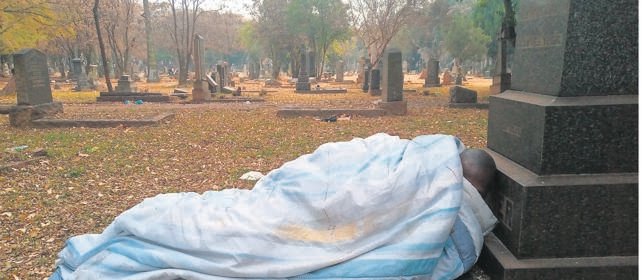 "It's Comfortable"- Man Uses Tombstone As His Bed