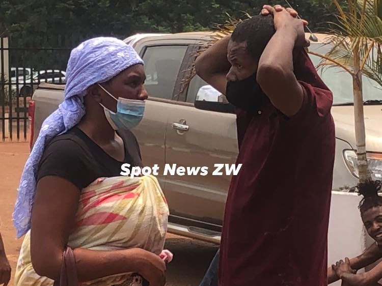 A wife visits husband at Harare Magistrates Court, he is part of the 16 who were arrested for participating in a sex party. It is believed they are being charged with disorderly conduc