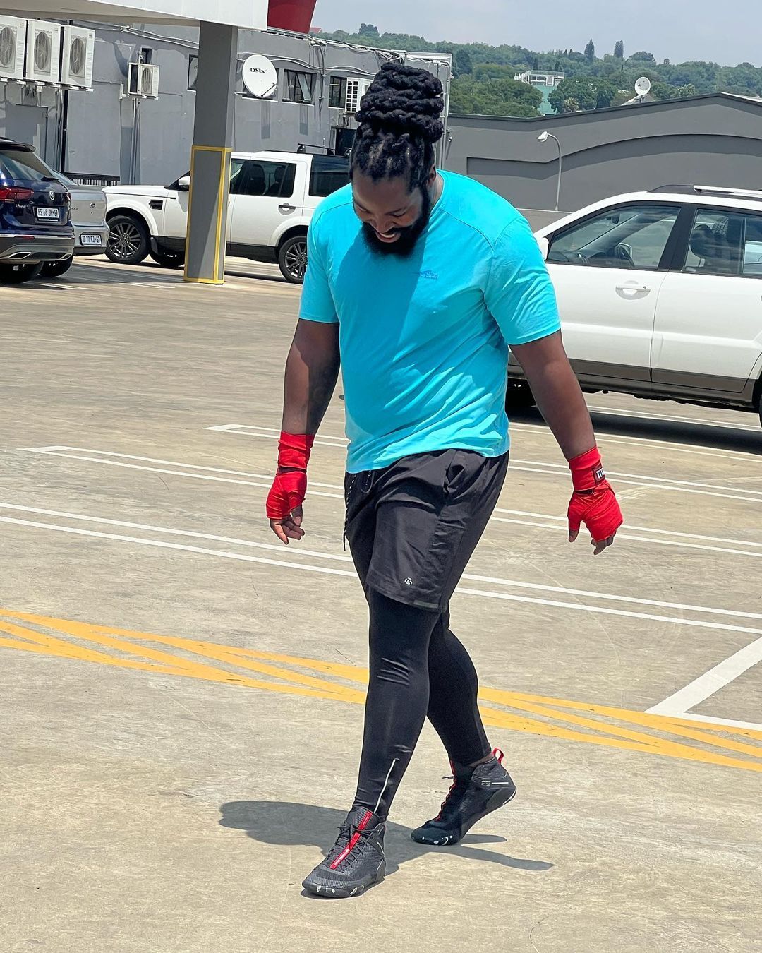 Big Zulu in gym gear outdoors